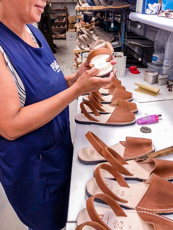 Artisan inspecting PONS shoes to make sure only the highest quality avarcas are delivered to you
