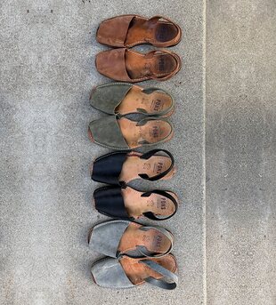 Four well-loved pairs of Pons Avarcas arranged on concrete. Photo by Martha Tuber.