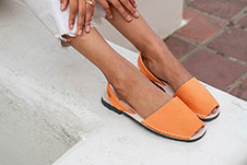 Model Wears Our Bold Classic Pons Avarca Sandal in Orange
