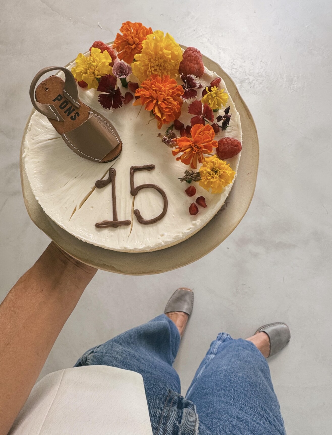 15th anniversary cake decorated with flowers and a miniature Pons avarca