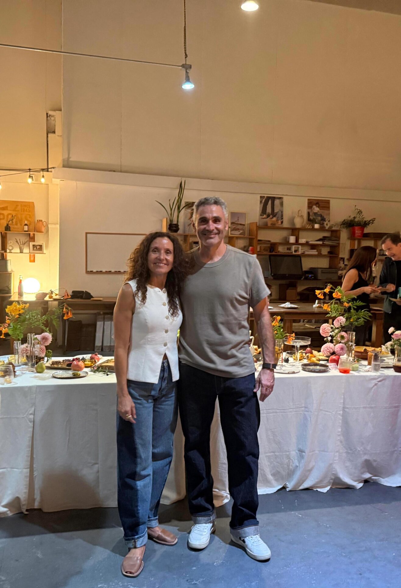 Noelia and Jose celebrating the 15th anniversary of Avarcas USA in the warehouse