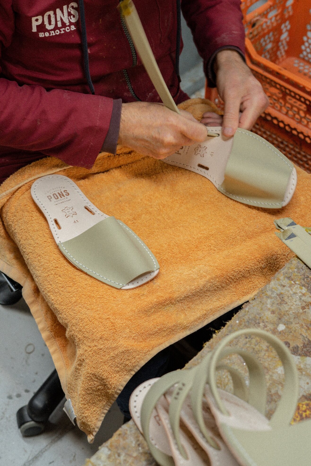An artisan hand-finishing an Olive 510 Classic Pons